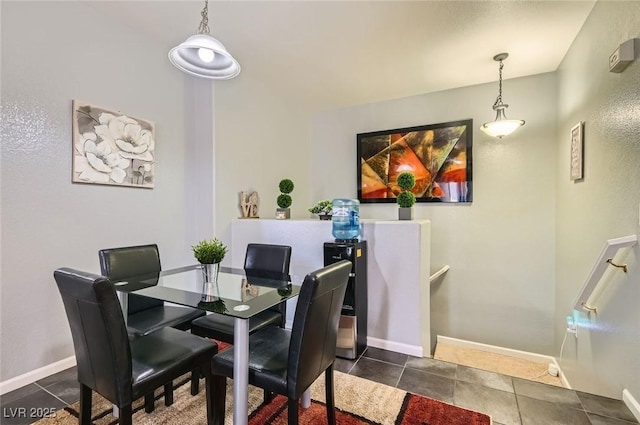 6321 Rolling Rose St Unit 201, North Las Vegas, NV 89081 - dining space with baseboards and dark tile patterned floors
