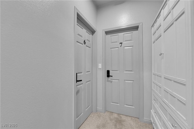 1808 Peyton Stewart Ct, North Las Vegas, NV 89086 - doorway with light carpet, a textured wall, and baseboards