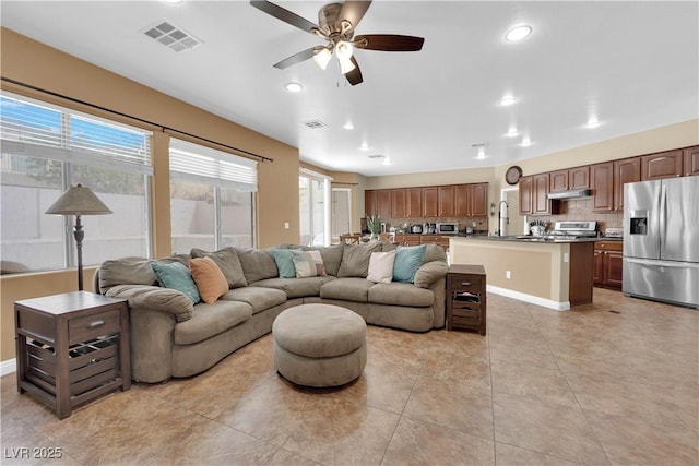 1808 Peyton Stewart Ct, North Las Vegas, NV 89086 - living area featuring a ceiling fan, light tile patterned floors, and recessed lighting