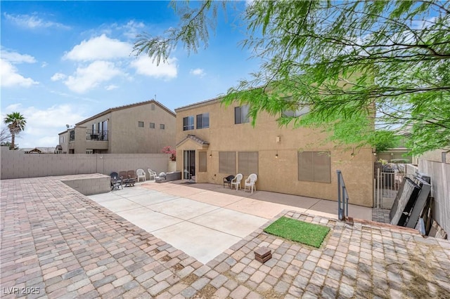 1808 Peyton Stewart Ct, North Las Vegas, NV 89086 - rear view of house featuring stucco siding, a fenced backyard, and a patio area