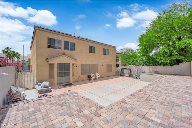 1808 Peyton Stewart Ct, North Las Vegas, NV 89086 - rear view of house featuring a patio area, a fenced backyard, and a gate