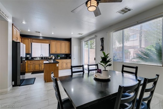 11004 Napa Ridge Dr, Las Vegas, NV 89144 - dining room featuring a ceiling fan, baseboards, and recessed lighting