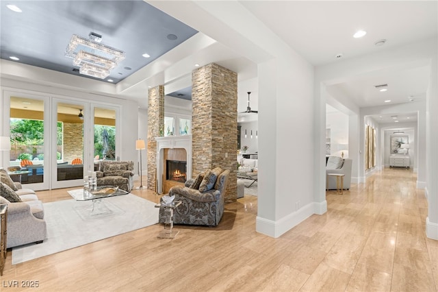 11 Misty Peaks Ct, Las Vegas, NV 89135 - living area with a fireplace, light wood finished floors, recessed lighting, and baseboards