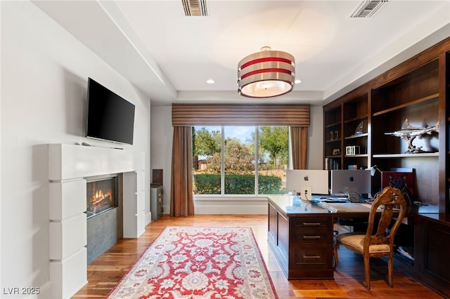 11 Misty Peaks Ct, Las Vegas, NV 89135 - office space featuring light wood-style floors, a glass covered fireplace, and recessed lighting