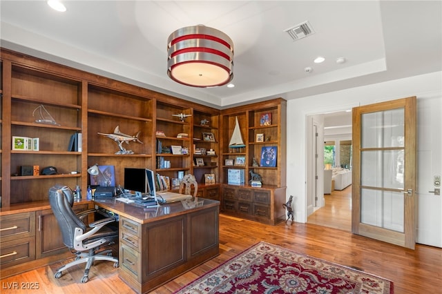 11 Misty Peaks Ct, Las Vegas, NV 89135 - home office with light wood finished floors, built in desk, and recessed lighting