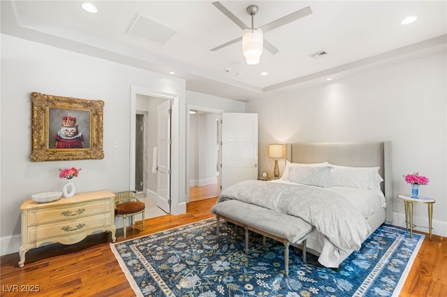 11 Misty Peaks Ct, Las Vegas, NV 89135 - bedroom with a tray ceiling, wood finished floors, recessed lighting, baseboards, and a ceiling fan