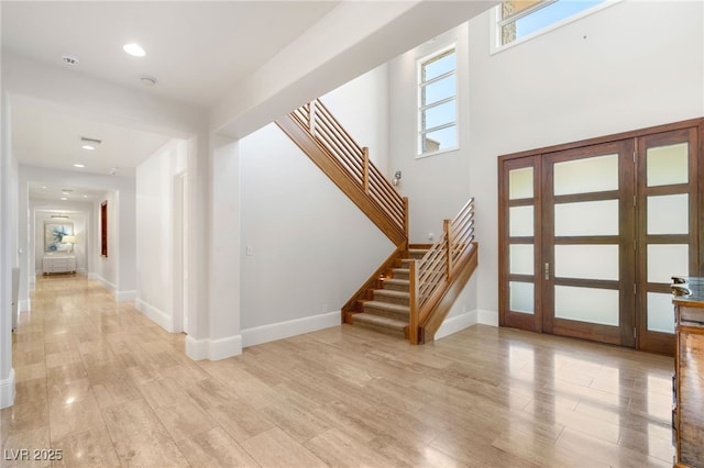 11 Misty Peaks Ct, Las Vegas, NV 89135 - foyer entrance with stairway, light wood-type flooring, and recessed lighting