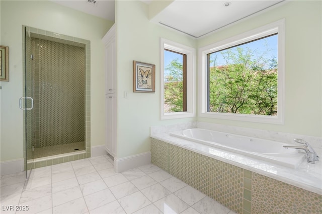 11 Misty Peaks Ct, Las Vegas, NV 89135 - full bath featuring a bath, a shower stall, baseboards, and tile patterned flooring