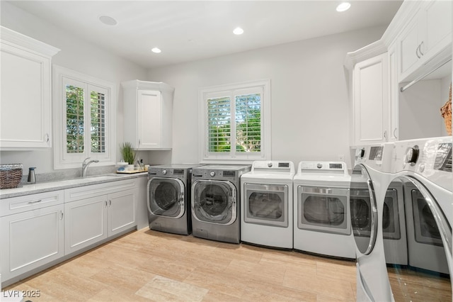 11 Misty Peaks Ct, Las Vegas, NV 89135 - laundry room featuring separate washer and dryer, cabinet space, recessed lighting, and light wood finished floors