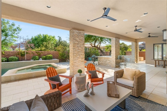 11 Misty Peaks Ct, Las Vegas, NV 89135 - fenced backyard featuring an in-ground hot tub, a patio, a ceiling fan, and an outdoor living space