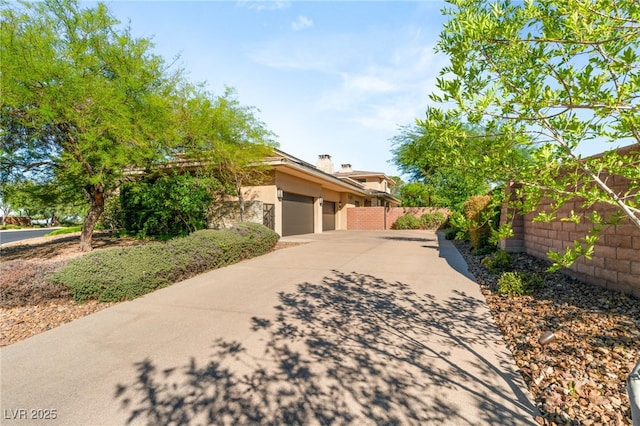 11 Misty Peaks Ct, Las Vegas, NV 89135 - view of front of house with concrete driveway, a garage, and stucco siding