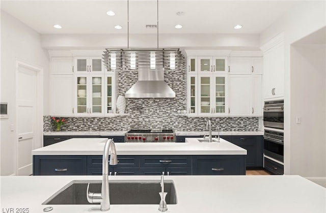 11 Misty Peaks Ct, Las Vegas, NV 89135 - kitchen featuring a sink, an island with sink, white cabinets, light countertops, and recessed lighting