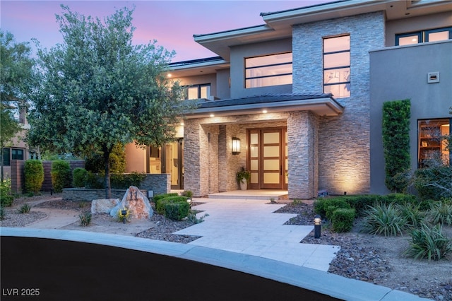 11 Misty Peaks Ct, Las Vegas, NV 89135 - view of exterior entry featuring stone siding and stucco siding