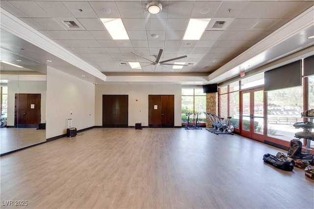 11 Misty Peaks Ct, Las Vegas, NV 89135 - exercise room featuring wood finished floors, ceiling fan, a raised ceiling, and a paneled ceiling