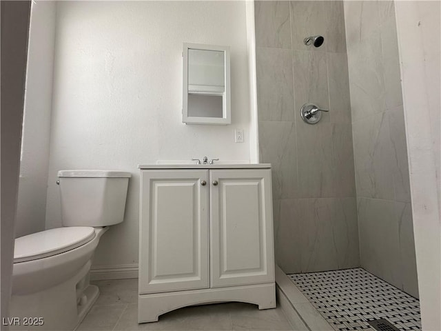 6905 Singing Dunes Ln, Las Vegas, NV 89145 - bathroom featuring toilet, a tile shower, and vanity