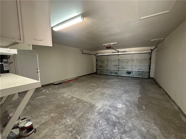 6905 Singing Dunes Ln, Las Vegas, NV 89145 - garage with a garage door opener and baseboards