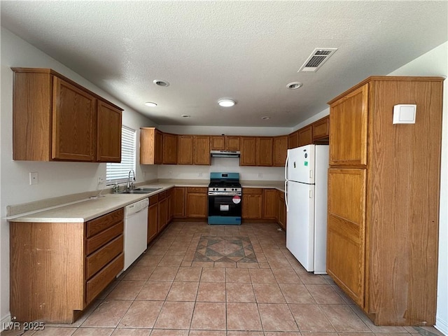 6905 Singing Dunes Ln, Las Vegas, NV 89145 - kitchen with white appliances, a sink, ventilation hood, light countertops, and brown cabinets