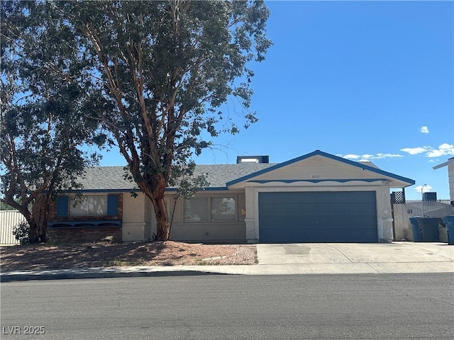 6905 Singing Dunes Ln, Las Vegas, NV 89145 - ranch-style home with a garage and concrete driveway