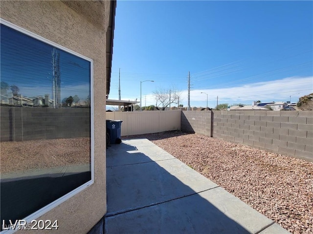 2711 Morning Break Ct, Las Vegas, NV 89142 - fenced backyard featuring a patio area
