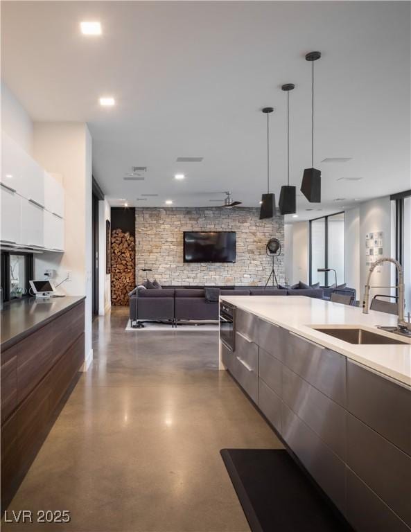 7030 Schirlls St, Las Vegas, NV 89118 - kitchen with modern cabinets, a sink, open floor plan, and finished concrete floors