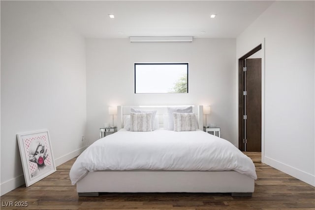 7030 Schirlls St, Las Vegas, NV 89118 - bedroom with baseboards, wood finished floors, and recessed lighting