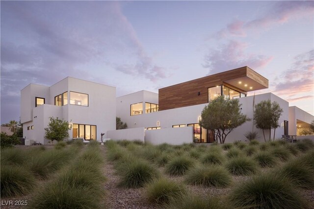7030 Schirlls St, Las Vegas, NV 89118 - rear view of property with stucco siding