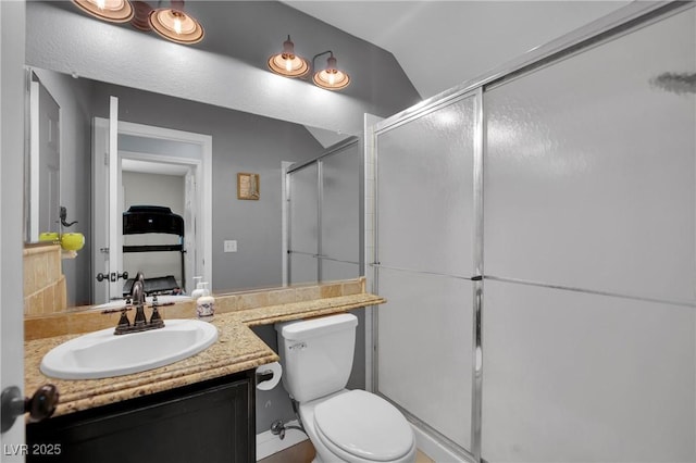 1335 Passiflora Dr, Henderson, NV 89002 - bathroom with toilet, vanity, a stall shower, and vaulted ceiling