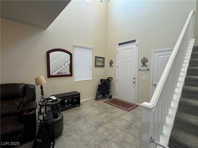 933 Kimbark Ave, Las Vegas, NV 89148 - foyer with stairway, light tile patterned floors, a towering ceiling, and baseboards