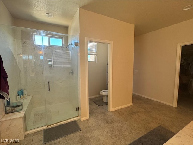 933 Kimbark Ave, Las Vegas, NV 89148 - bathroom featuring toilet, a stall shower, and baseboards