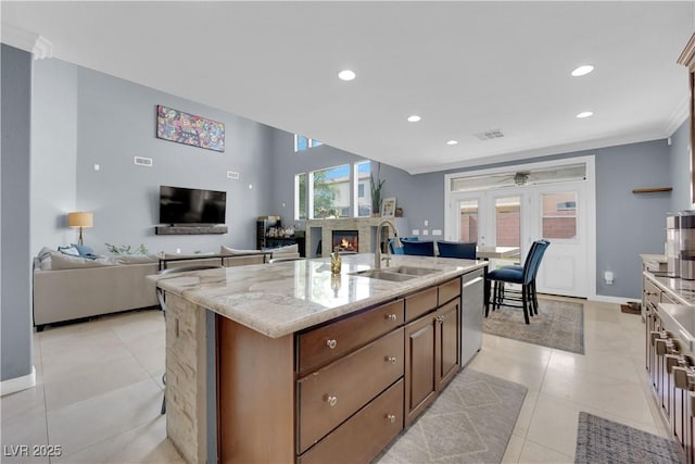 8268 Nelson Ridge Ln, Las Vegas, NV 89178 - kitchen with a sink, stainless steel dishwasher, ceiling fan, recessed lighting, and a glass covered fireplace