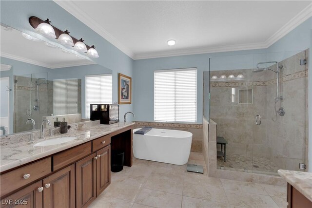 8268 Nelson Ridge Ln, Las Vegas, NV 89178 - bathroom featuring vanity, a stall shower, a soaking tub, tile patterned flooring, and crown molding