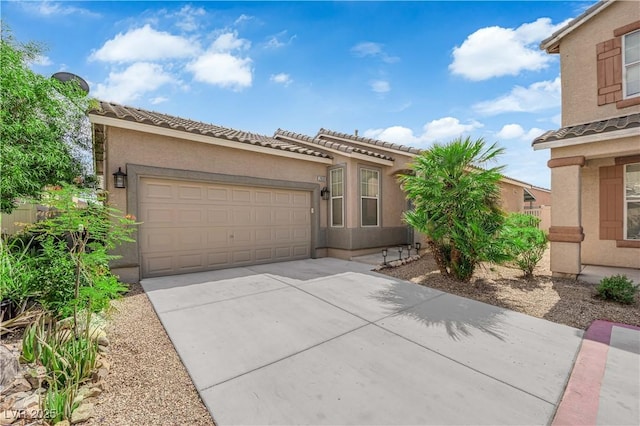 2633 Spider Cactus Ct, Las Vegas, NV 89106 - mediterranean / spanish-style home featuring driveway, an attached garage, stucco siding, and a tiled roof