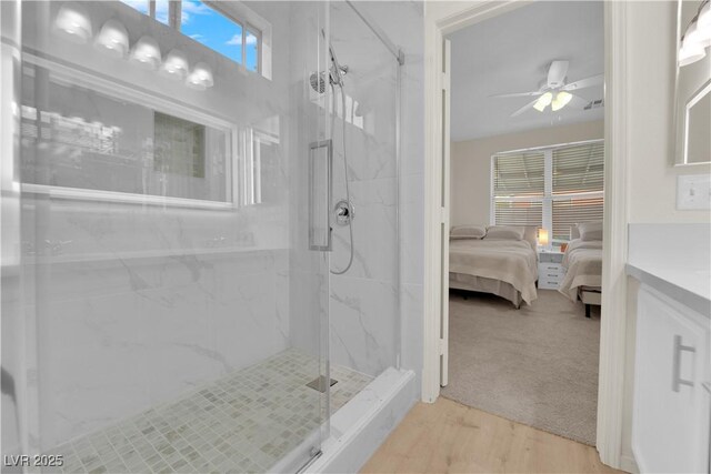 2633 Spider Cactus Ct, Las Vegas, NV 89106 - full bath with a marble finish shower, ensuite bath, ceiling fan, vanity, and wood finished floors