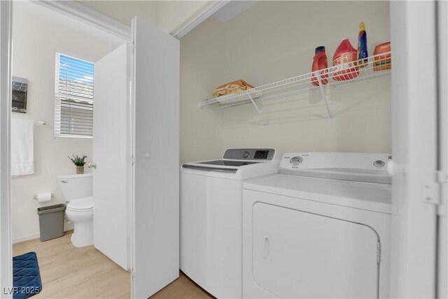 2633 Spider Cactus Ct, Las Vegas, NV 89106 - laundry area with washer and dryer and light wood-style floors