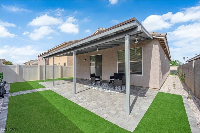 2633 Spider Cactus Ct, Las Vegas, NV 89106 - rear view of house featuring stucco siding and a patio