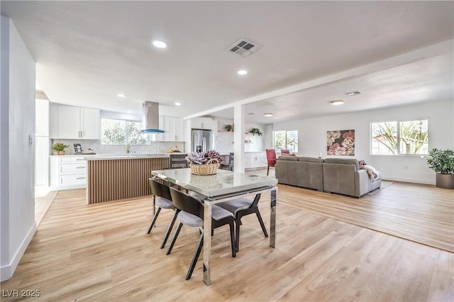 1731 Sherwin Ln, Las Vegas, NV 89156 - dining space with healthy amount of natural light, light wood-style flooring, baseboards, and recessed lighting