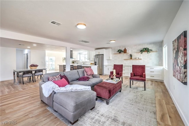 1731 Sherwin Ln, Las Vegas, NV 89156 - living area featuring light wood-style floors and baseboards