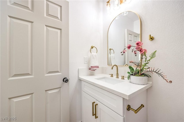 1731 Sherwin Ln, Las Vegas, NV 89156 - bathroom featuring vanity and a textured wall