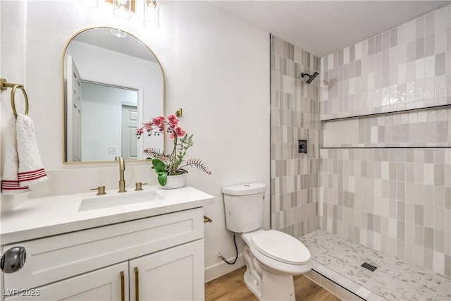 1731 Sherwin Ln, Las Vegas, NV 89156 - full bath featuring a tile shower, vanity, toilet, and wood finished floors