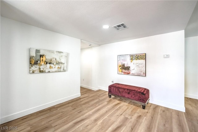 1731 Sherwin Ln, Las Vegas, NV 89156 - sitting room with light wood-type flooring, baseboards, and recessed lighting