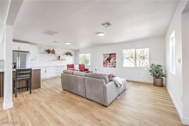 1731 Sherwin Ln, Las Vegas, NV 89156 - living room featuring light wood-style floors and baseboards