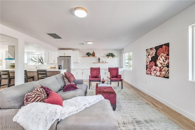 1731 Sherwin Ln, Las Vegas, NV 89156 - living area featuring light wood-style flooring and baseboards