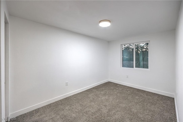 1731 Sherwin Ln, Las Vegas, NV 89156 - spare room featuring dark carpet and baseboards