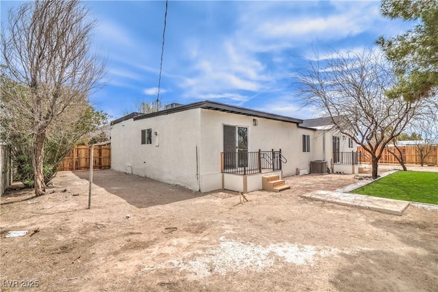 1731 Sherwin Ln, Las Vegas, NV 89156 - back of house featuring central AC and stucco siding