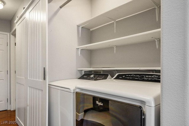 5099 Mascaro Dr, Las Vegas, NV 89122 - laundry area featuring separate washer and dryer and dark wood finished floors