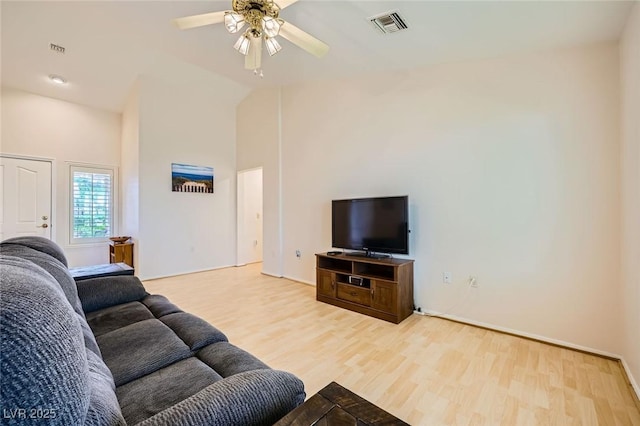 9024 Starmount Dr, Las Vegas, NV 89134 - living area featuring wood finished floors, a ceiling fan, and high vaulted ceiling