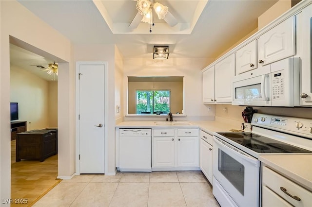 9024 Starmount Dr, Las Vegas, NV 89134 - kitchen with white appliances, ceiling fan, a sink, white cabinets, and light countertops