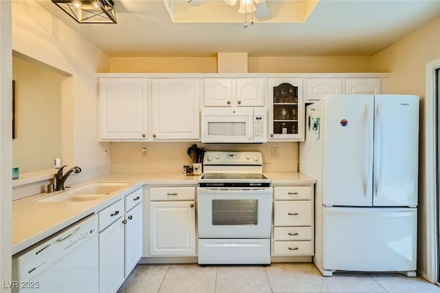 9024 Starmount Dr, Las Vegas, NV 89134 - kitchen featuring white appliances, a sink, white cabinetry, and light tile patterned floors