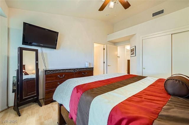 9024 Starmount Dr, Las Vegas, NV 89134 - bedroom with light wood-type flooring, ceiling fan, and a closet