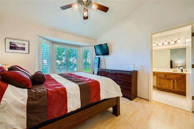 9024 Starmount Dr, Las Vegas, NV 89134 - bedroom with lofted ceiling, light wood-type flooring, connected bathroom, ceiling fan, and a sink